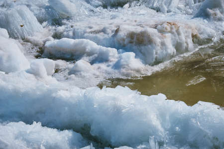 Blocks of ice on the river in spring. Needle texture. Sunny day.の写真素材