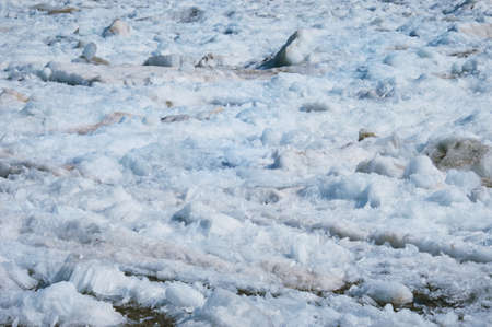 Melting river ice. Columnar and needle-like structure of crystals. Ice floe in the spring on the...