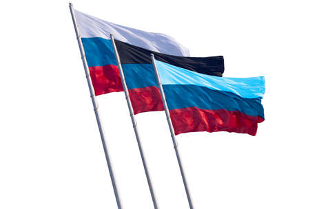 Flags of Russia and the partially recognized republics of Donetsk and Lugansk oblasts isolated on a white background. Close-up of banners fluttering in the wind. A group of three objects.の写真素材