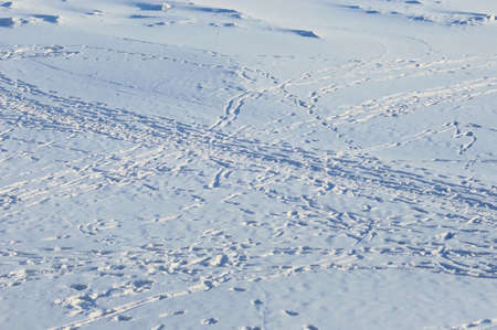 Footprints in the snow on a sunny winter day. view from above.の写真素材