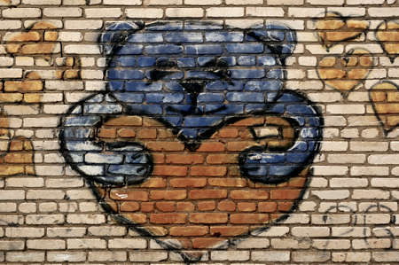 Teddy bear painted on brick wall. Street art.の写真素材