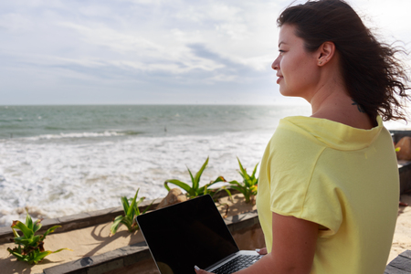 Girl working with a laptopの写真素材