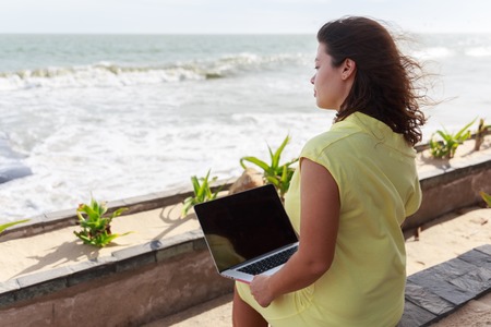Girl working with a laptopの写真素材