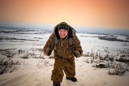 man on the hill in the winter