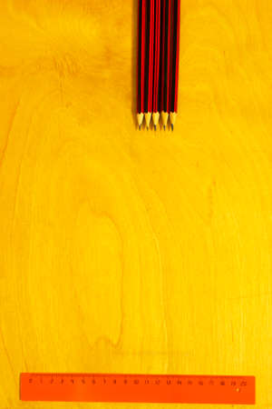 the line of pencil on a yellow backgroundの写真素材