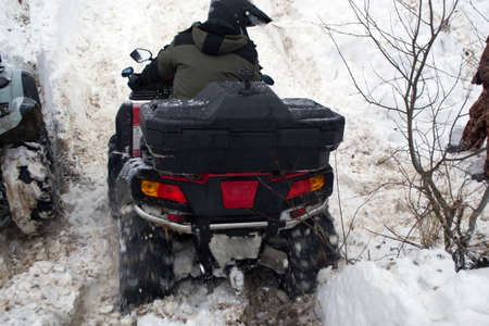 ATV winter race with people wearing helmets