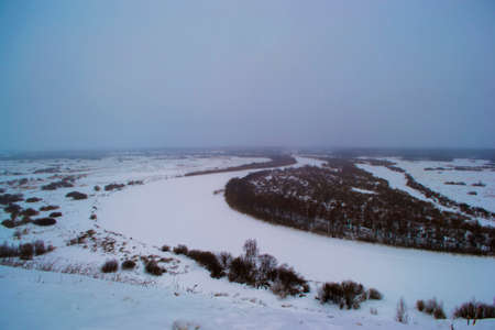 beautiful winter landscape of hills and rivers