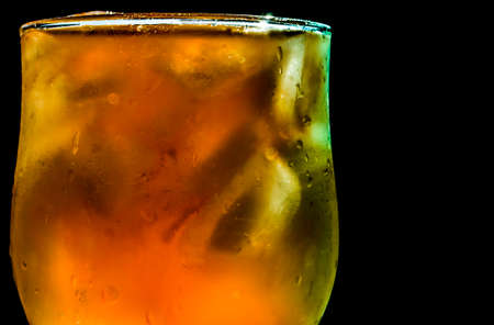 glass of water with ice on black backgroundの写真素材