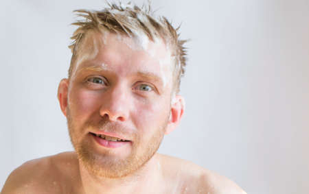 a man washes his head with shampooの写真素材