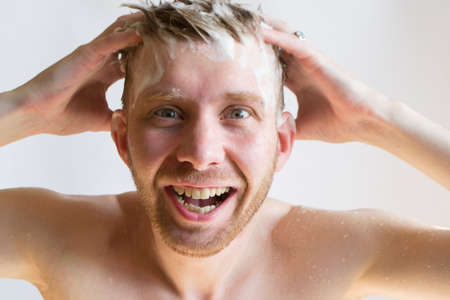 a man washes his head with shampooの写真素材
