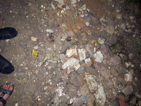 feet with shoes on the pavementの写真素材