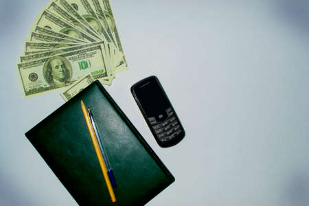money, Notepad , phone and pen with pencilの写真素材