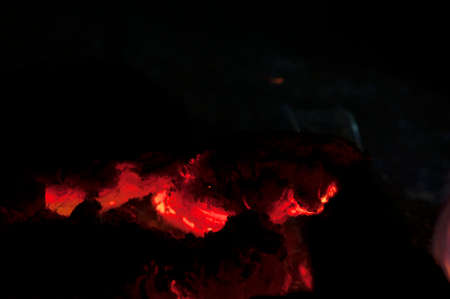 Orange fire flames on a black background