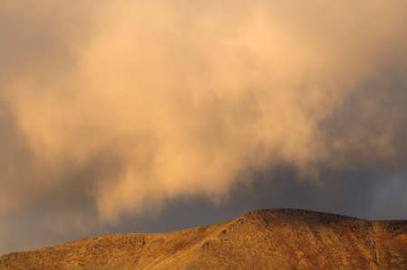 Autumn in the mountains Russian north of the mountain Khibiny. Khibiny mountains in autumn with thick white clouds. The majestic mountains are an indispensable place for all lovers of skiing and tourism.の写真素材