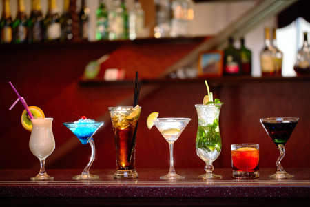 Set of classic alcohol cocktails on bar backgroundの写真素材