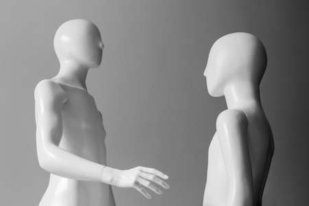 Two mennequins. Parent and child. Social dominance. Conflict of interestの写真素材