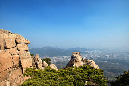 View on Seoul from Jaunbong Peak in Bukhansan National Park, Koreaの写真素材