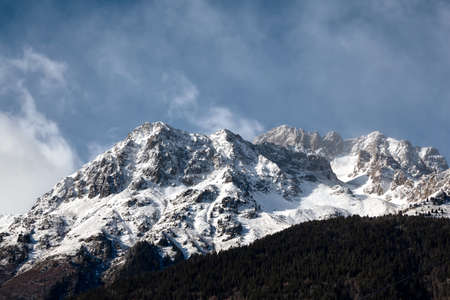 Snow-capped alps in windy day