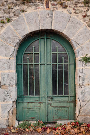 antique door in a stone houseの写真素材