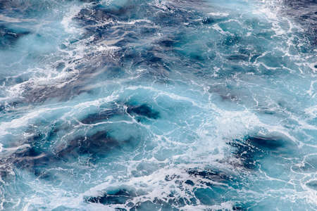 sea waves behind the shipの写真素材