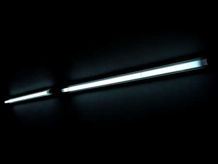 Fluorescent Lamp. Daylight lamp. Light in the dark.の写真素材