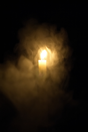 Candle in the dark. Candle in the dark in dimuの写真素材