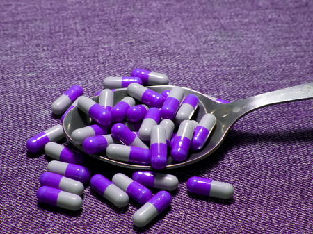 Spilled pills. Spilled tablets in capsules on the table