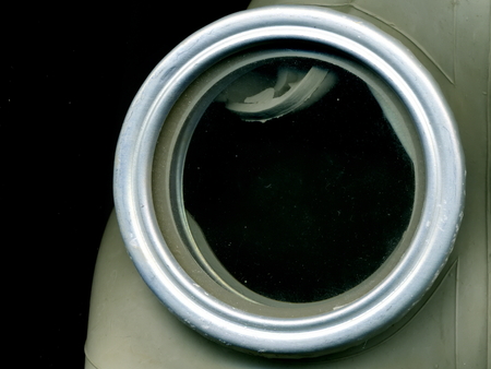 Old Soviet green gas mask. The eye of an old gas mask. Means of individual protection....