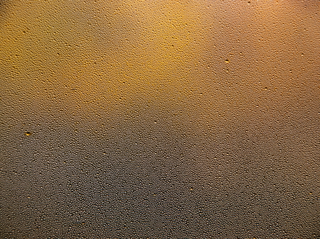 Drops of water on a cold glass. Condensate on glassの写真素材