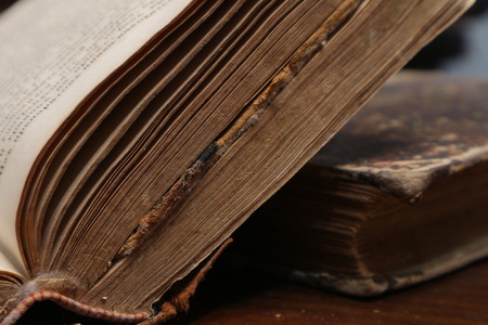 Yellowed pages of the old dilapidated book. Old book. Folio. Yellowed from old age bookの写真素材