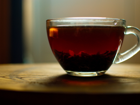 Transparent cup of golden strong tea. Glass cup with tea.の写真素材