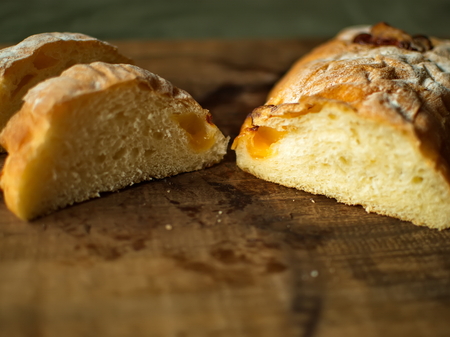 Ciabatta Bread with cheese. Sliced fresh bread on a wooden tray. Fresh bread.