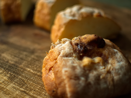 Ciabatta Bread with cheese. Sliced fresh bread on a wooden tray. Fresh bread.