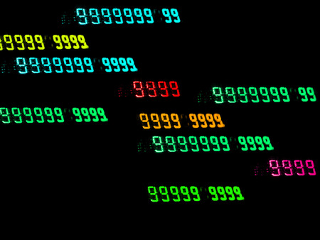 Old numeric display. Glowing numbers. A lot of nines. A lot of bright nines. Greenの写真素材