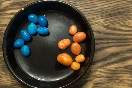 Multicolored round candy lying on the burlap. Multi-colored candies dragee. Small round candyの写真素材