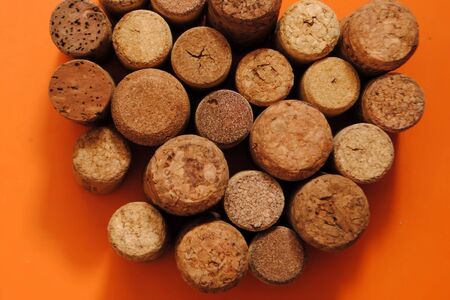 Wine corks on an orange background. Wine corks. Different wine corks.の写真素材