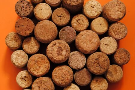 Wine corks on an orange background. Wine corks. Different wine corks.の写真素材