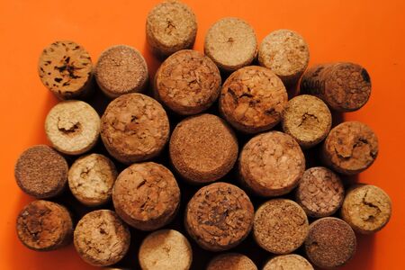 Wine corks on an orange background. Wine corks. Different wine corks.の写真素材