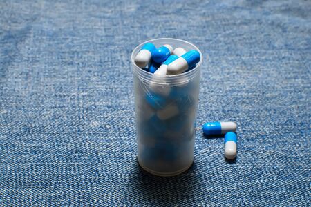 Multi-colored pills on a table. Multi-colored round pills.の写真素材