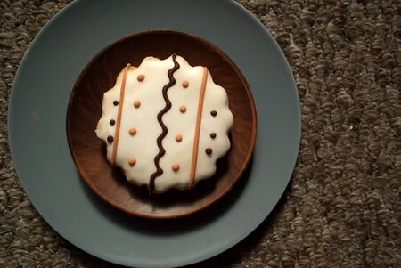 Cookies with white icing and wavy ornament. A cookie with an ornament. Tasty cookie.の写真素材
