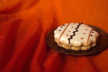 Cookies with white icing and wavy ornament. A cookie with an ornament. Tasty cookie.の写真素材