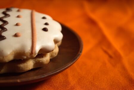 Cookies with white icing and wavy ornament. A cookie with an ornament. Tasty cookie.の写真素材