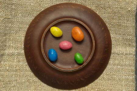 Multi-colored sweets on a clay plate. Colored candies on a plate.の写真素材
