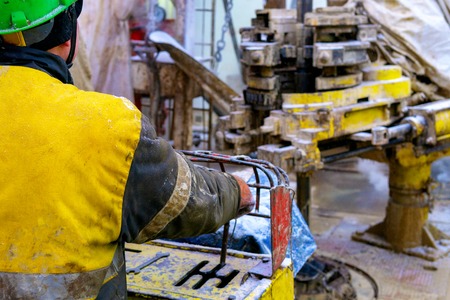 Offshore oil rig worker prepare tool and equipment for perforation oil and gas well at wellhead...