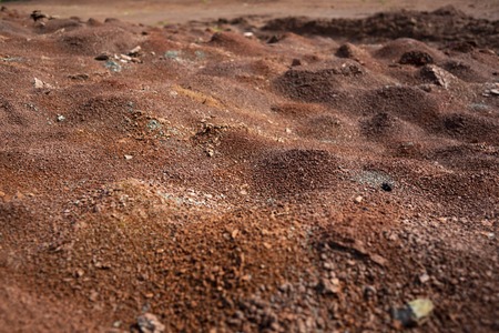 Red earth or soil background. Tropical laterite soil  background of red clay. Dry Orange surface, Picture of natural disaster. Drought land Caused by global warming and deforestation.の写真素材
