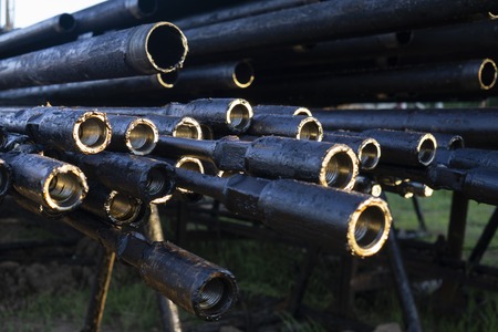 Oil Drill pipe. Rusty drill pipes were drilled in the well section. Downhole drilling rig. Laying...