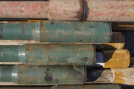 Oil Drill pipe. Rusty drill pipes were drilled in the well section. Downhole drilling rig. Laying...