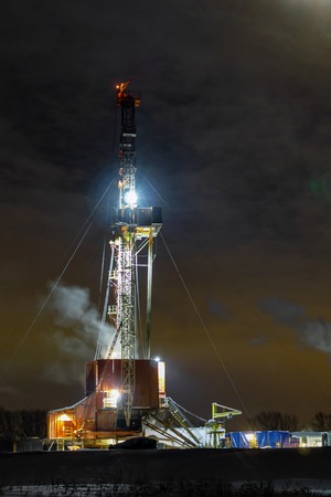 The beautiful sunrise landscape of Drilling rig in onshore oilfield of Russia. Oil drilling rig operation on the oil platform in oil and gas industryの写真素材