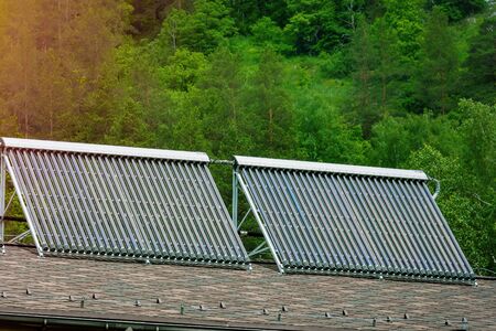 Solar glass tube hot water panel array on a roof