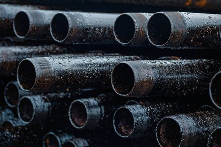 Oil Drill pipe. Rusty drill pipes were drilled in the well section. Downhole drilling rig. Laying...